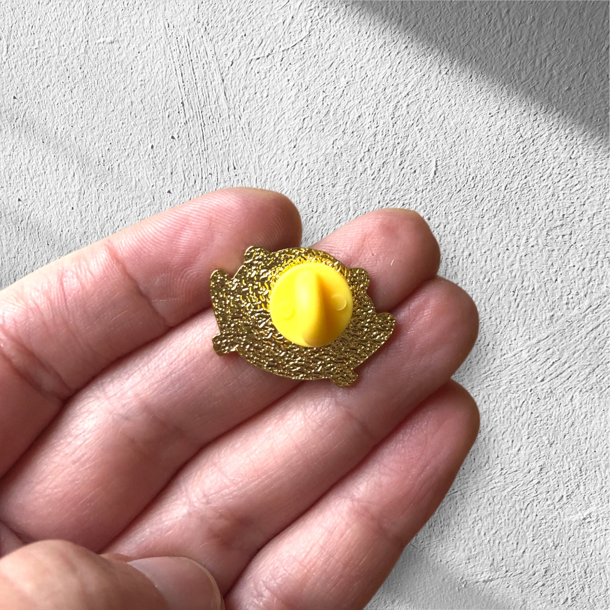 back of frog pin, showing rubber backing