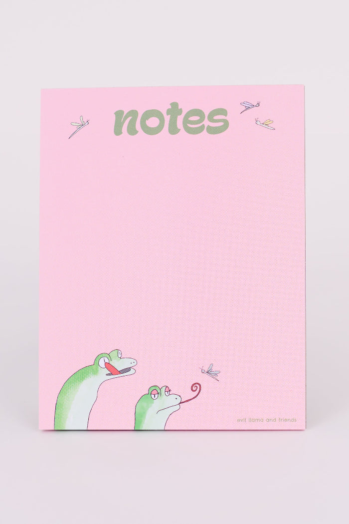 a pink notepad showing 2 cartoon geckos on the bottom, with their tongues out, catching fireflies. the text on top reads "notes" in green