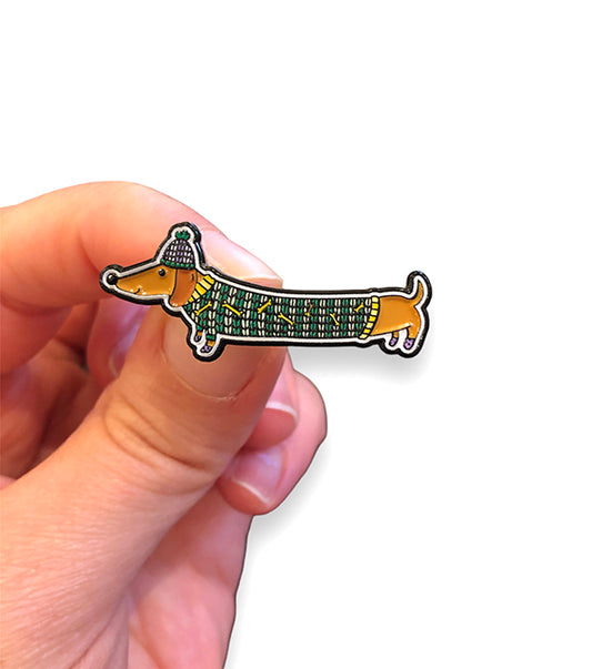 cute dachshund pin in hand, the perfect gift for dog lovers and dachshund owners