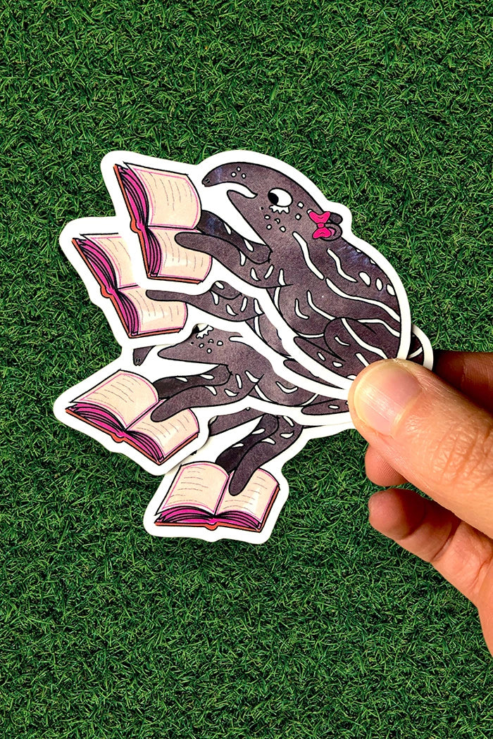4 stickers of abby the tapir, holding a book on a green grass background