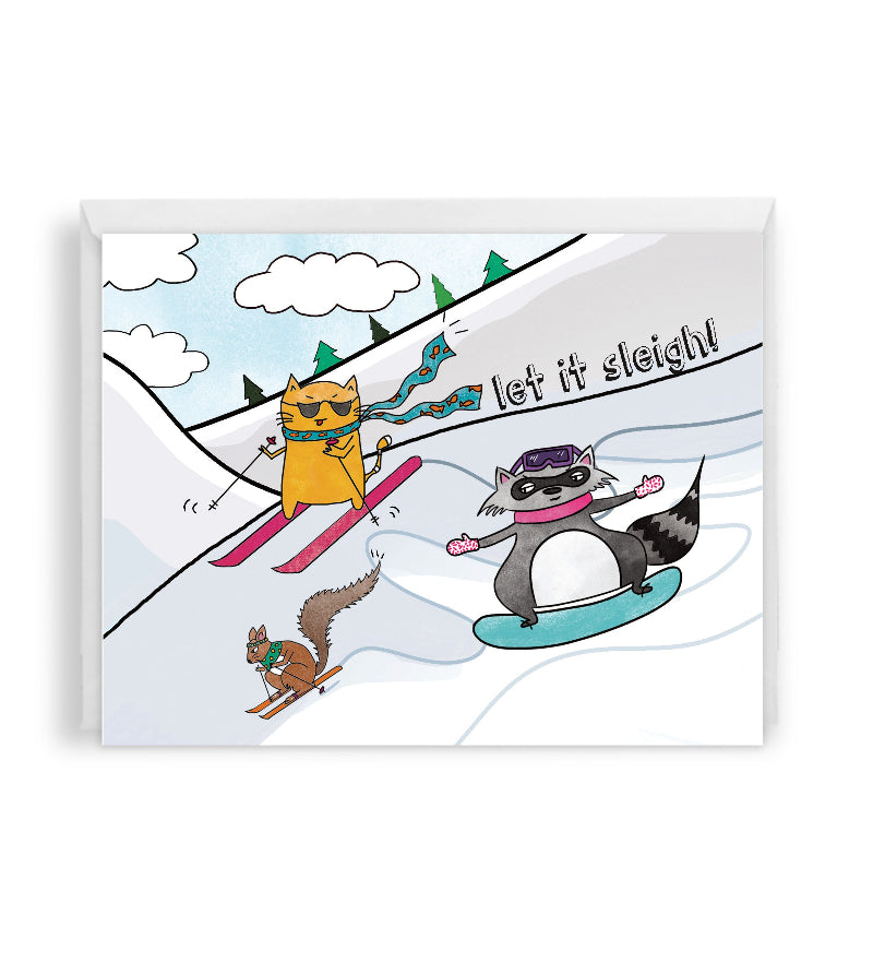holiday greeting card with cartoon animals skiing and snowboarding on a snowy mountain landscape, set against a white envelope