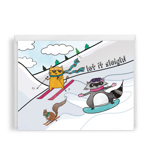 holiday greeting card with cartoon animals skiing and snowboarding on a snowy mountain landscape, set against a white envelope