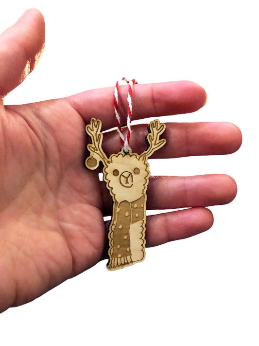 llama ornament in hand