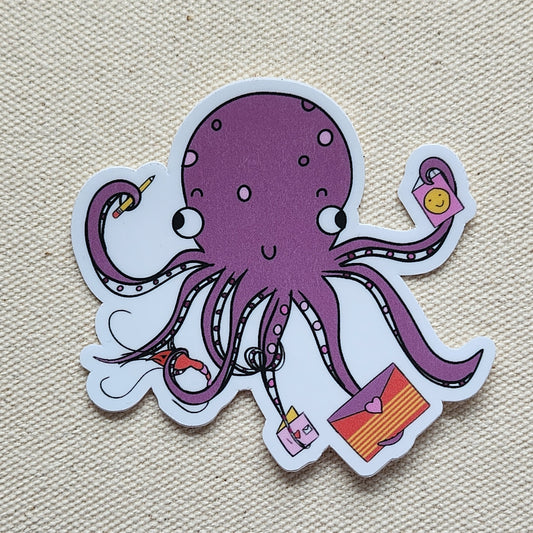 purple octopus sticker on a beige textured background