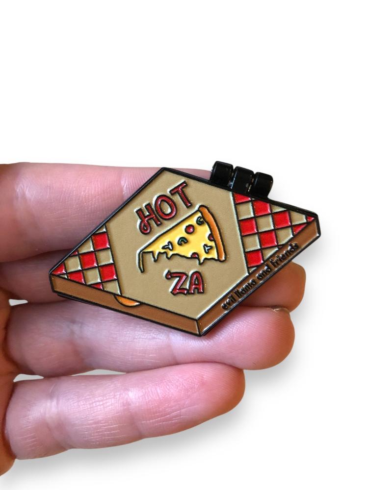 pizza rat pin in hand to show scale