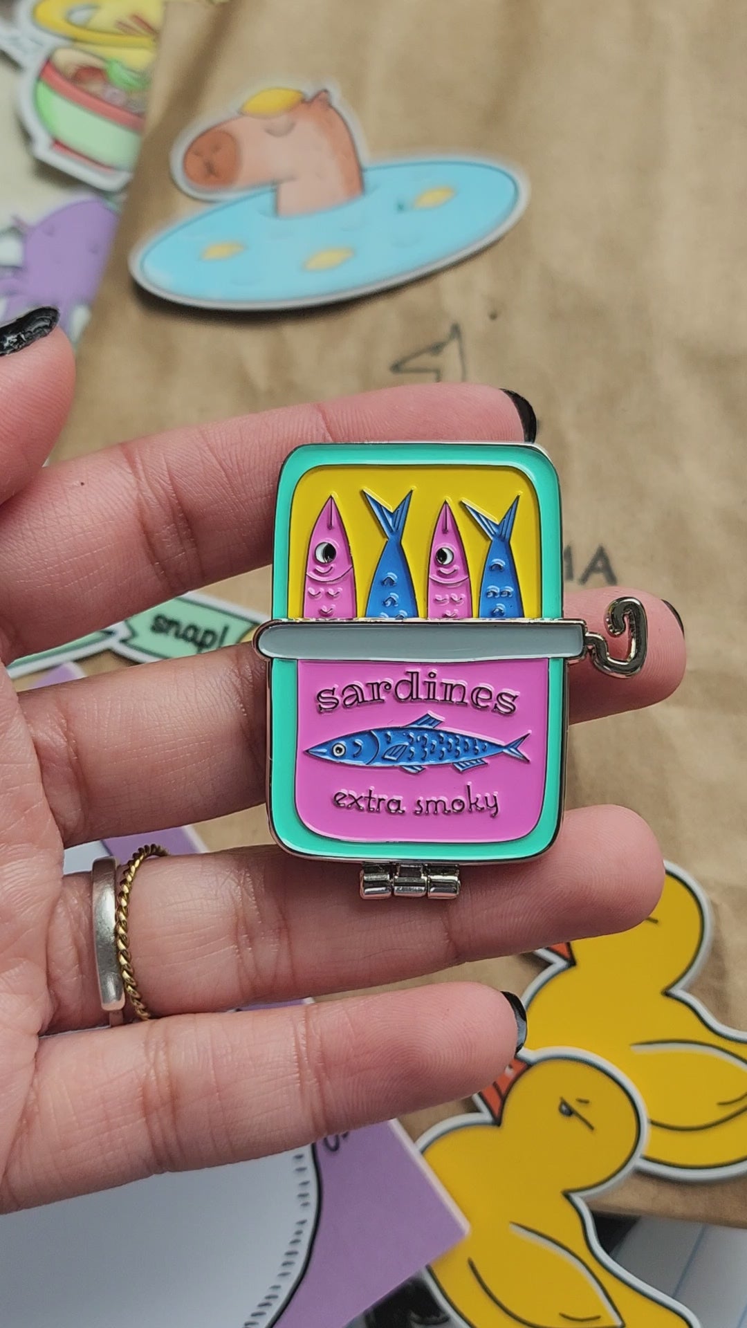 interactive sardine can pin. open the can to reveal some smoking fish.