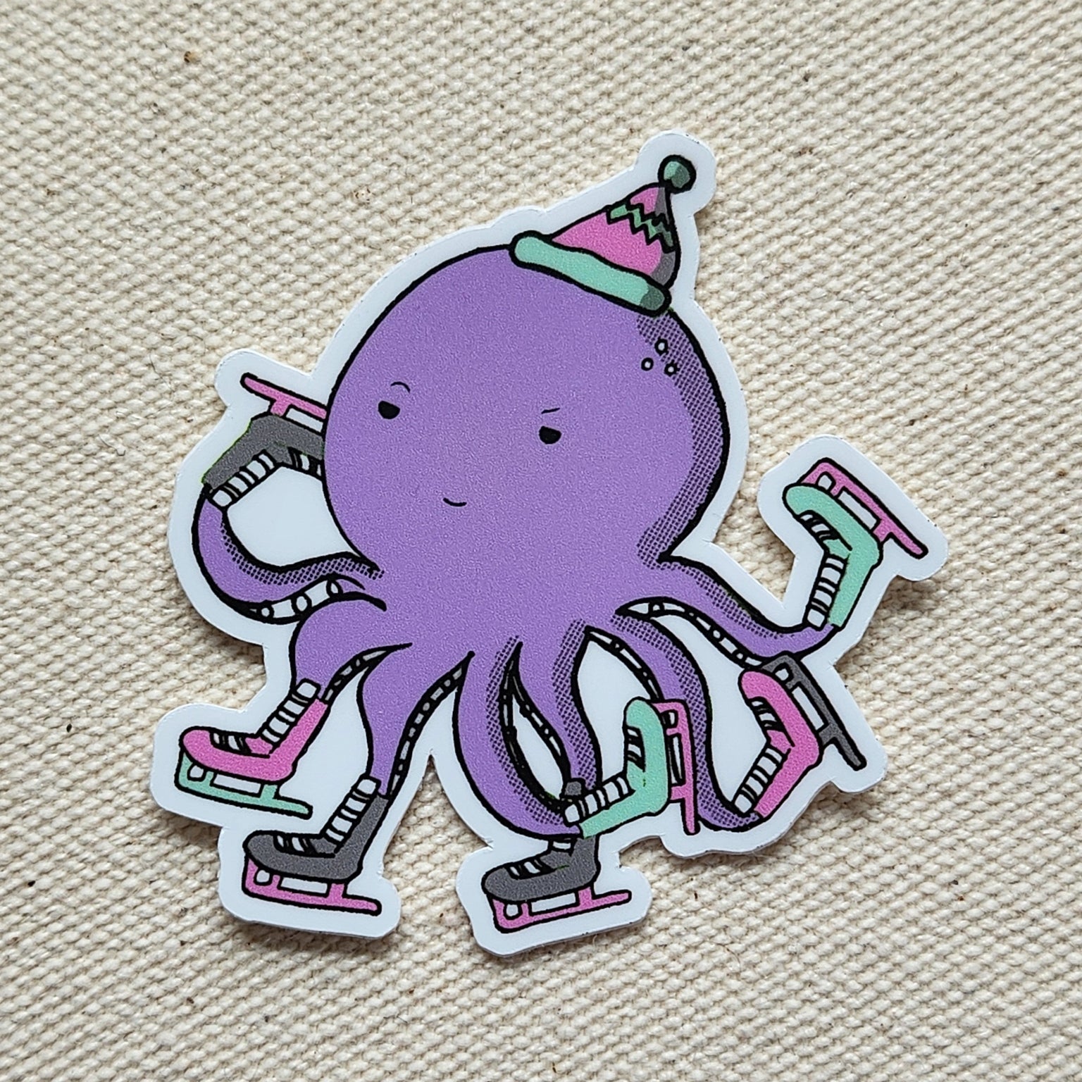 sticker of a purple skating octopus on a beige, textured background