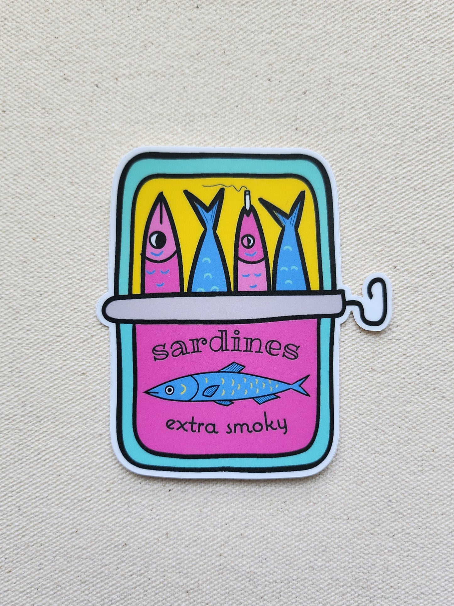 a sticker of a can of sardines, against a beige textured background