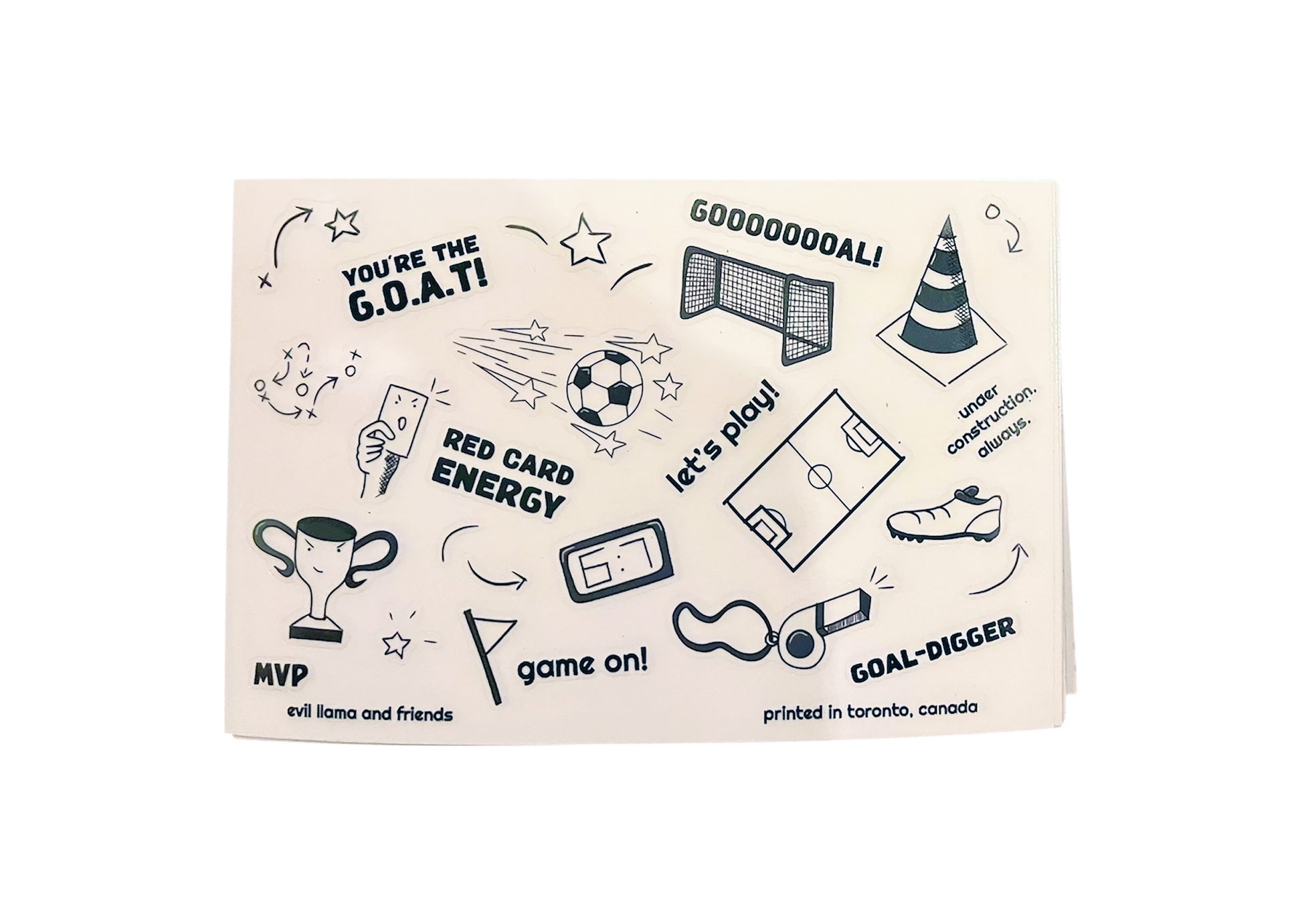 transparent sticker sheet with black and white soccer elements and text such as whistle, soccer ball, and trophy 