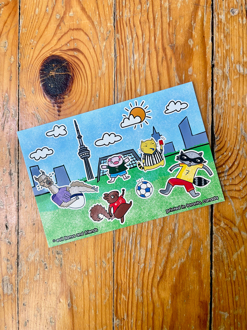 Sticker sheet with cartoon characters playing soccer in Toronto on a wooden surface
